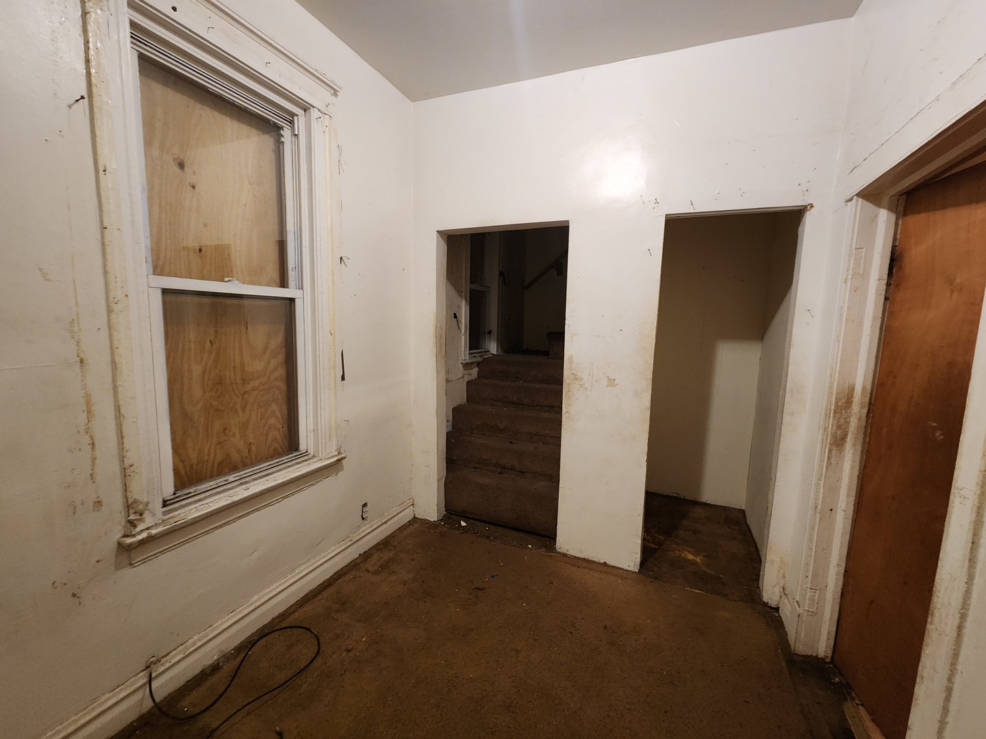 5242 South Sangamon Street Chicago, IL 60609 - Photo 8 of 14 an empty room with closet and wooden door