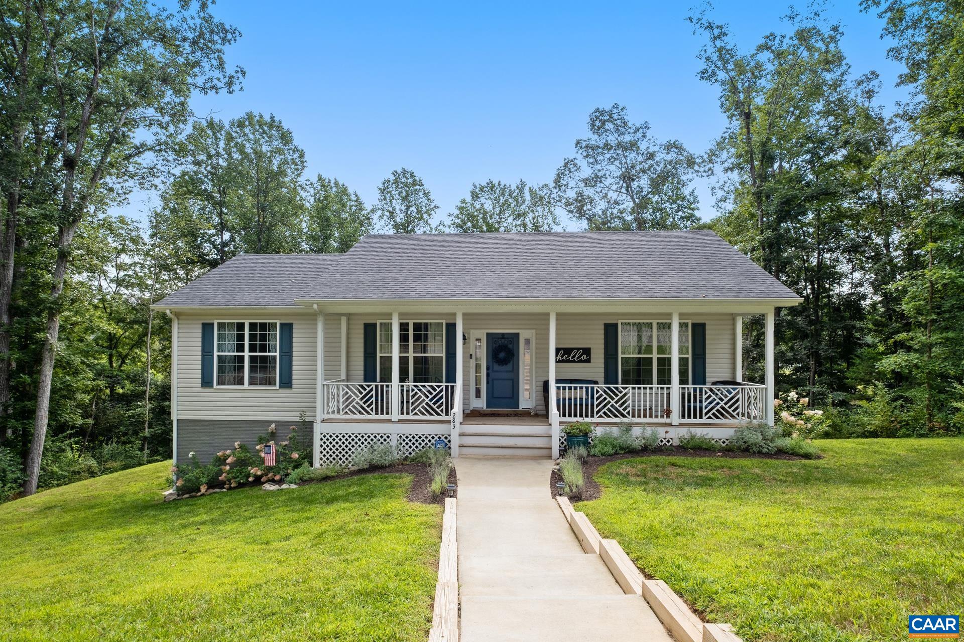 283 Logtrac Road Stanardsville, VA 22973 - Photo 1 of 49 a view of a house with a yard deck and a large tree