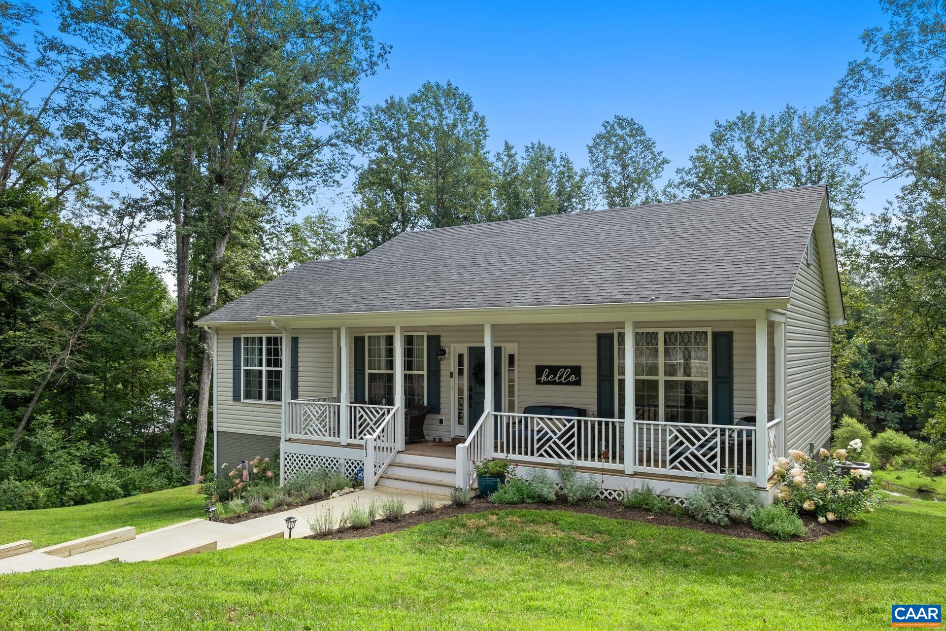 283 Logtrac Road Stanardsville, VA 22973 - Photo 2 of 49 a view of a house with a yard and a large tree