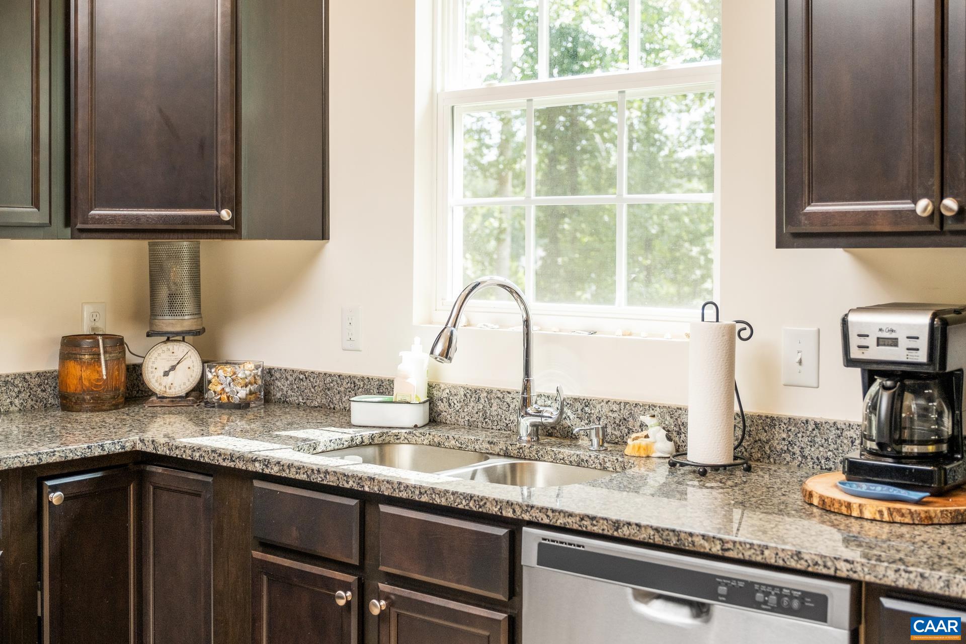 283 Logtrac Road Stanardsville, VA 22973 - Photo 29 of 49 a kitchen with granite countertop stainless steel appliances sink and cabinets