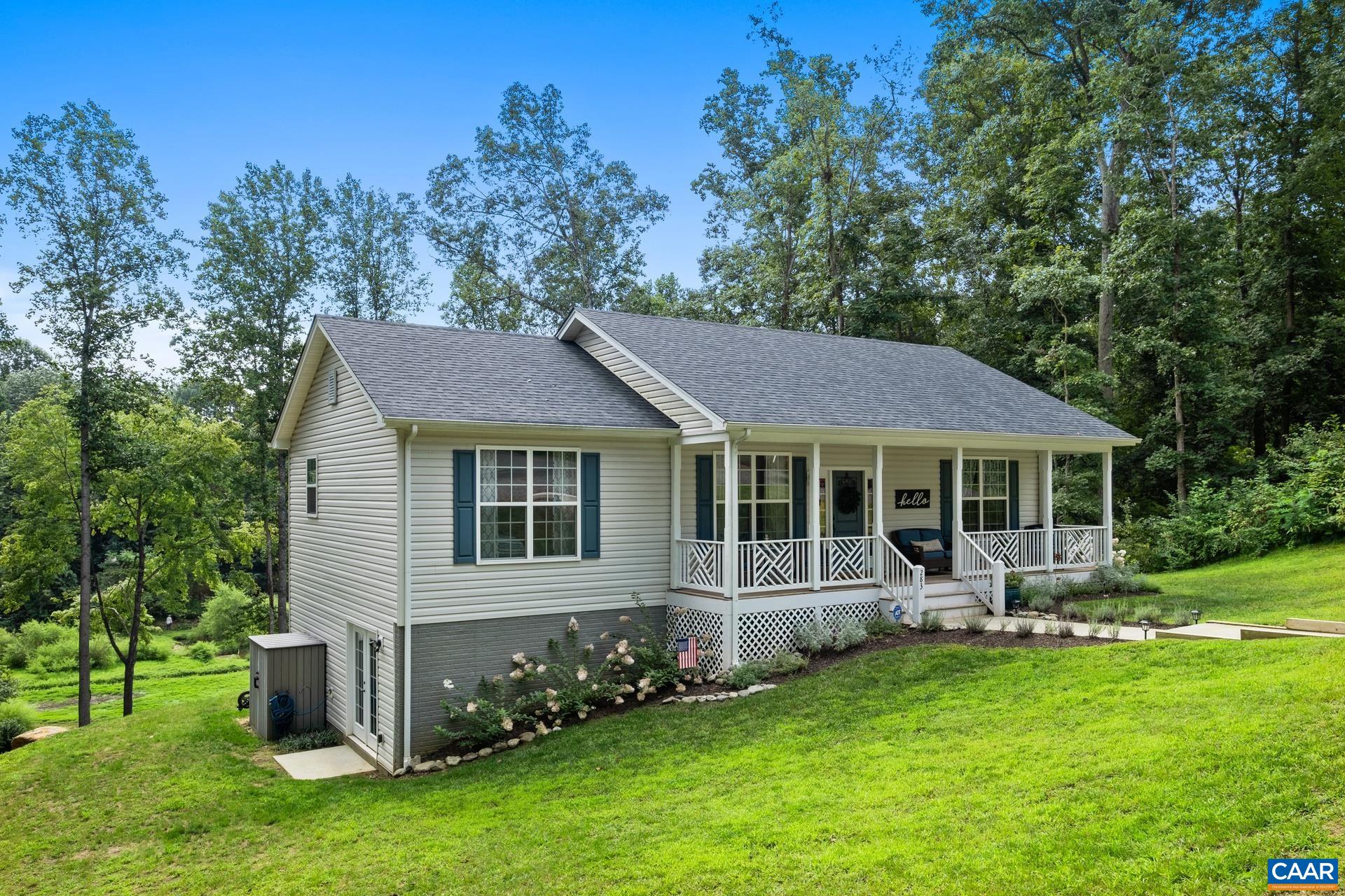 283 Logtrac Road Stanardsville, VA 22973 - Photo 3 of 49 a front view of a house with a garden