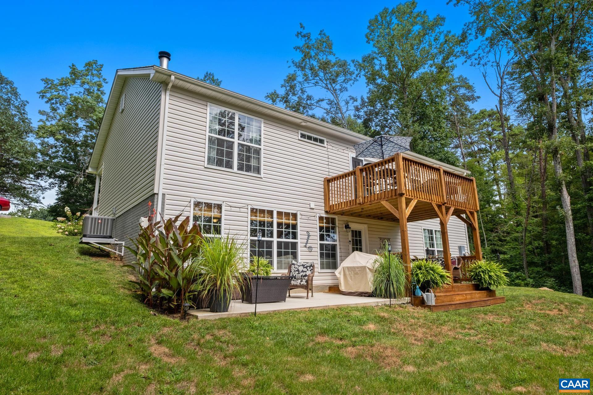 283 Logtrac Road Stanardsville, VA 22973 - Photo 34 of 49 a view of a house with backyard porch and sitting area