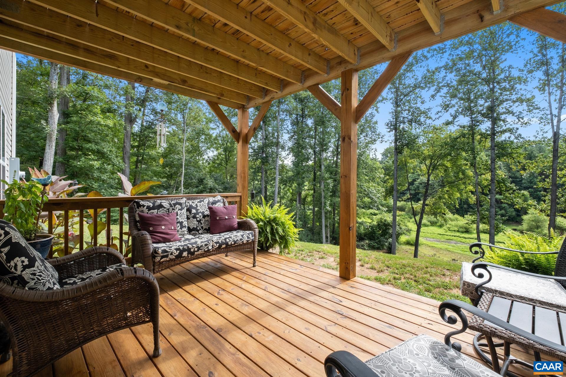 283 Logtrac Road Stanardsville, VA 22973 - Photo 36 of 49 a view of a patio with wooden floor chairs and wooden floor