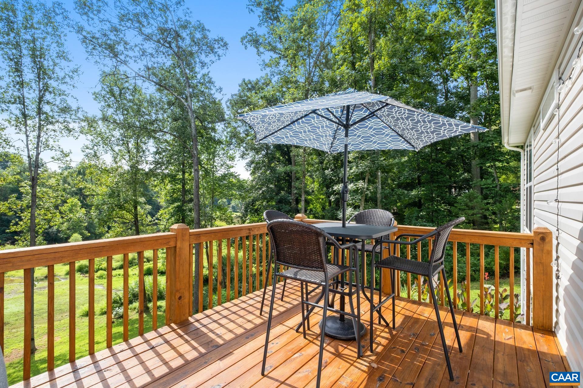 283 Logtrac Road Stanardsville, VA 22973 - Photo 39 of 49 a view of balcony with furniture and umbrella
