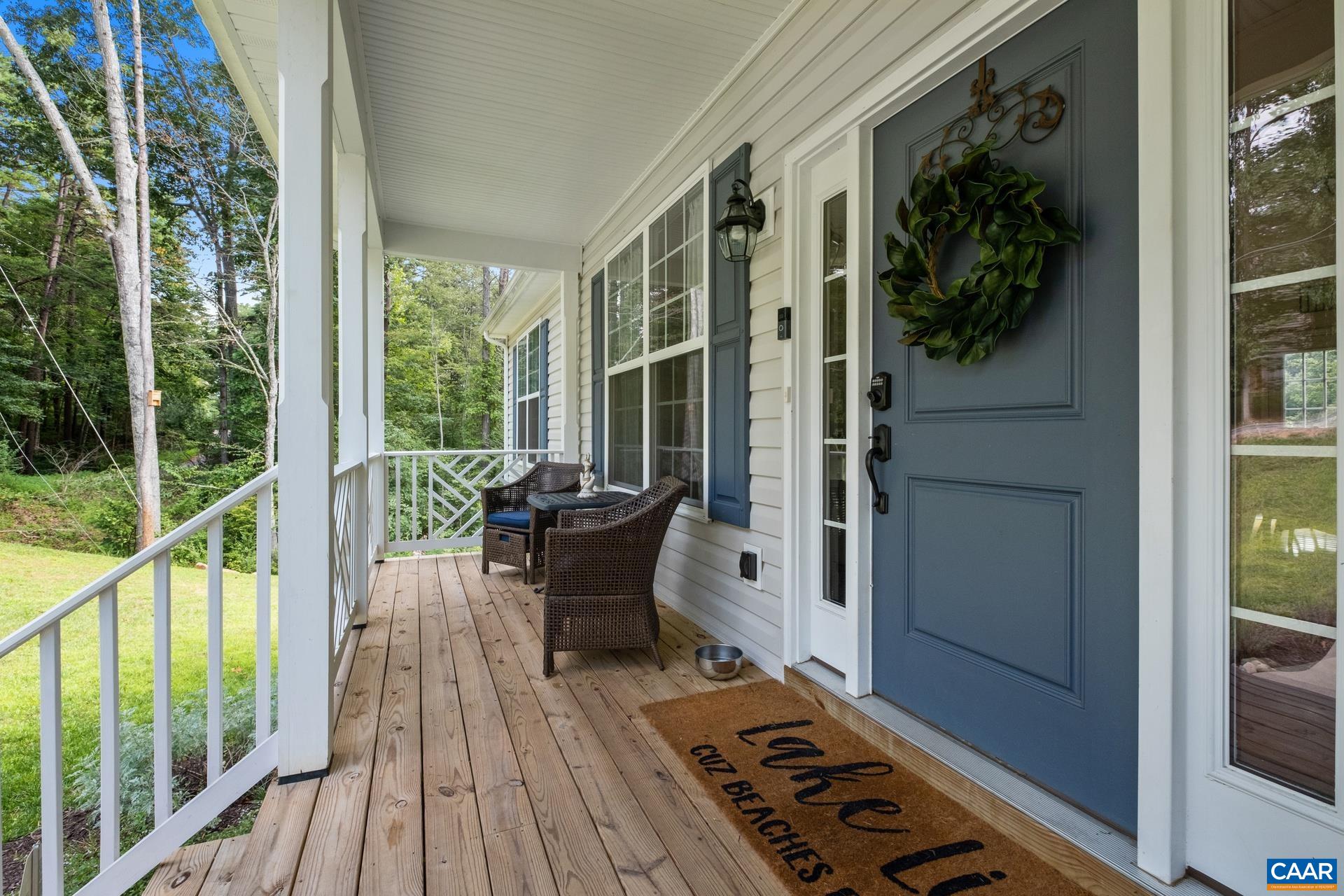 283 Logtrac Road Stanardsville, VA 22973 - Photo 4 of 49 a view of balcony with wooden floor and outdoor seating