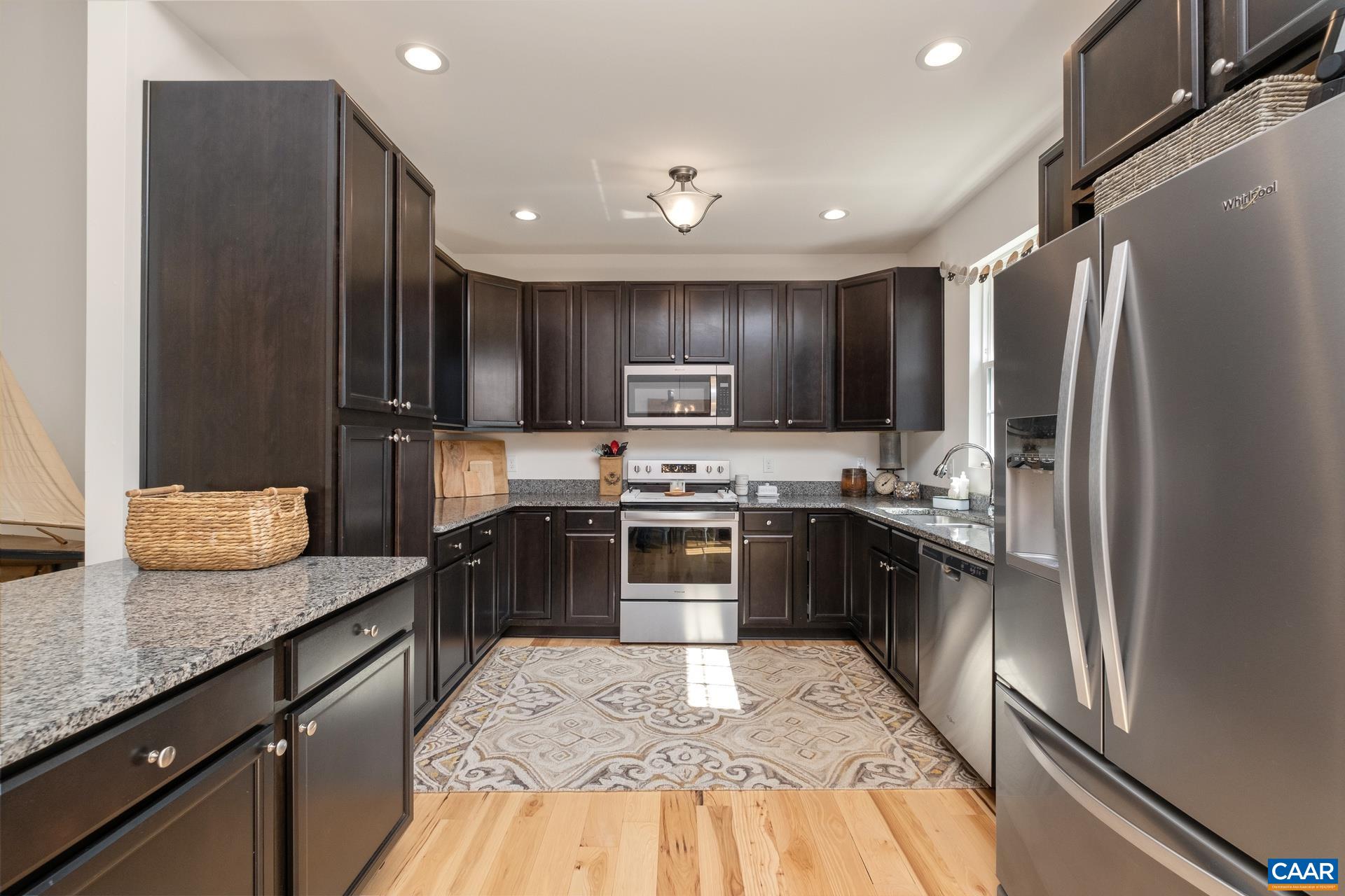 283 Logtrac Road Stanardsville, VA 22973 - Photo 8 of 49 a kitchen with stainless steel appliances granite countertop a refrigerator a stove a sink and a microwave