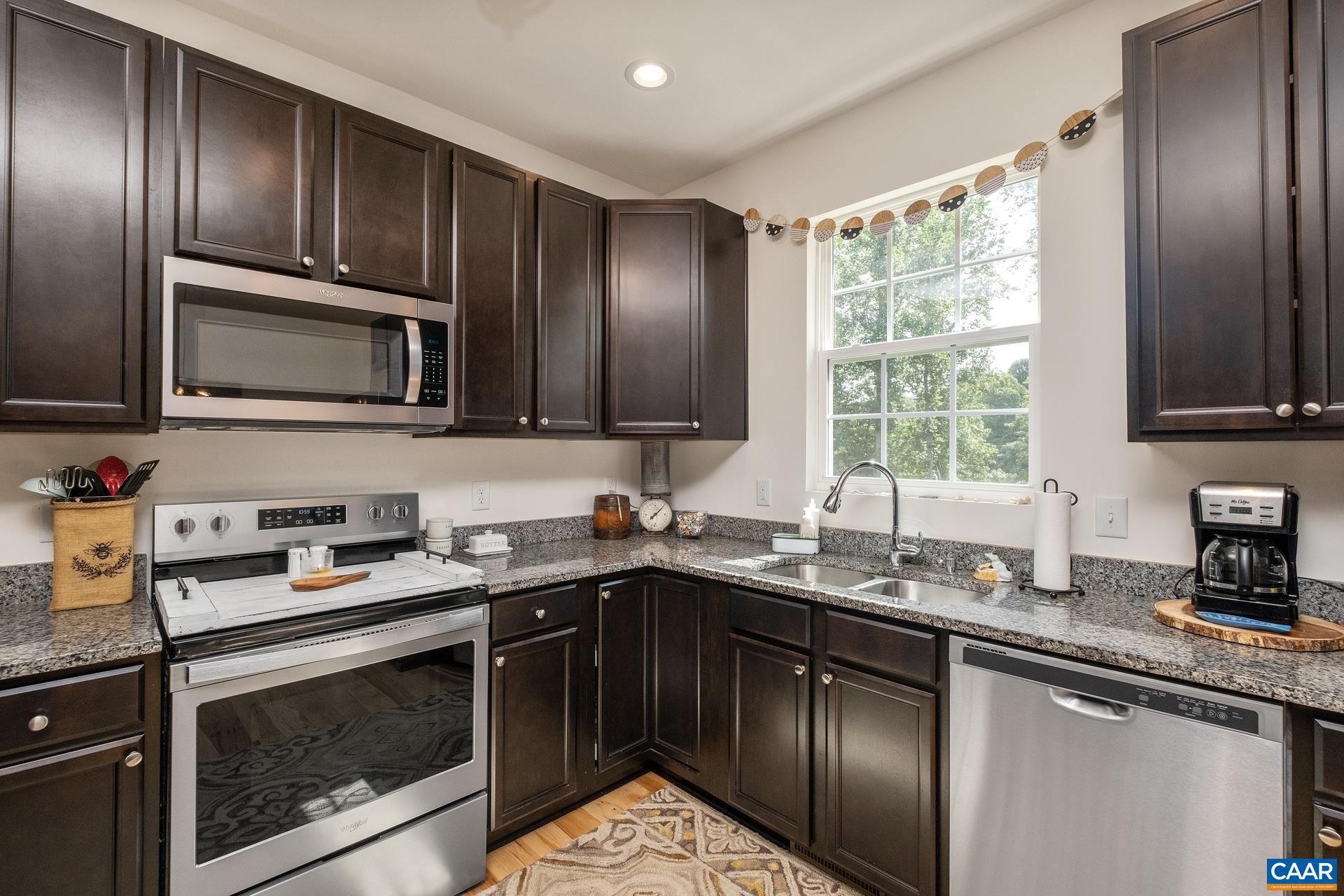 283 Logtrac Road Stanardsville, VA 22973 - Photo 10 of 49 a kitchen with granite countertop cabinets stainless steel appliances a sink and a window
