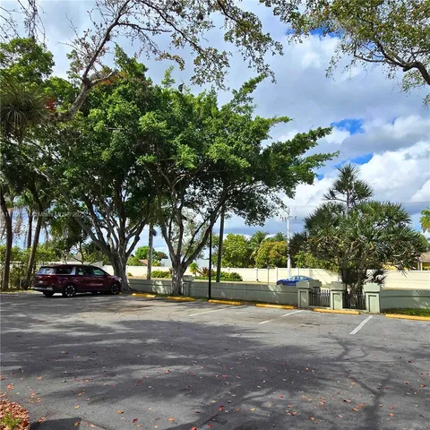 a view of street with parked cars