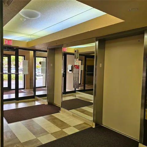 a view of a room with large windows