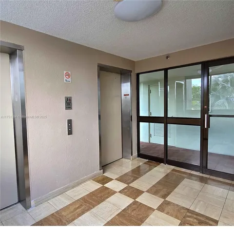 a view of a room with a floor to ceiling window