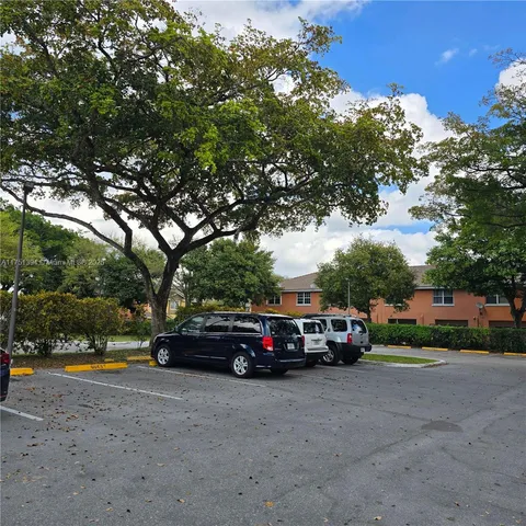a view of street with parked cars