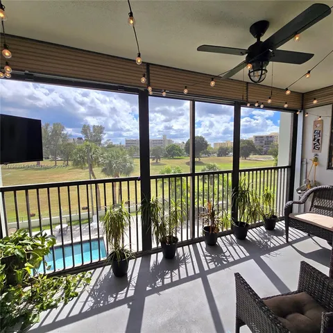 a view of balcony with furniture