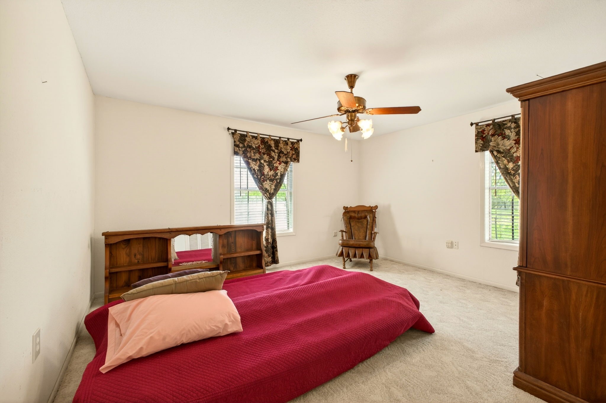 212 Halstedt Road La Grange, TX 78945 - Photo 14 of 40 a bedroom with a bed a chandelier and a closet