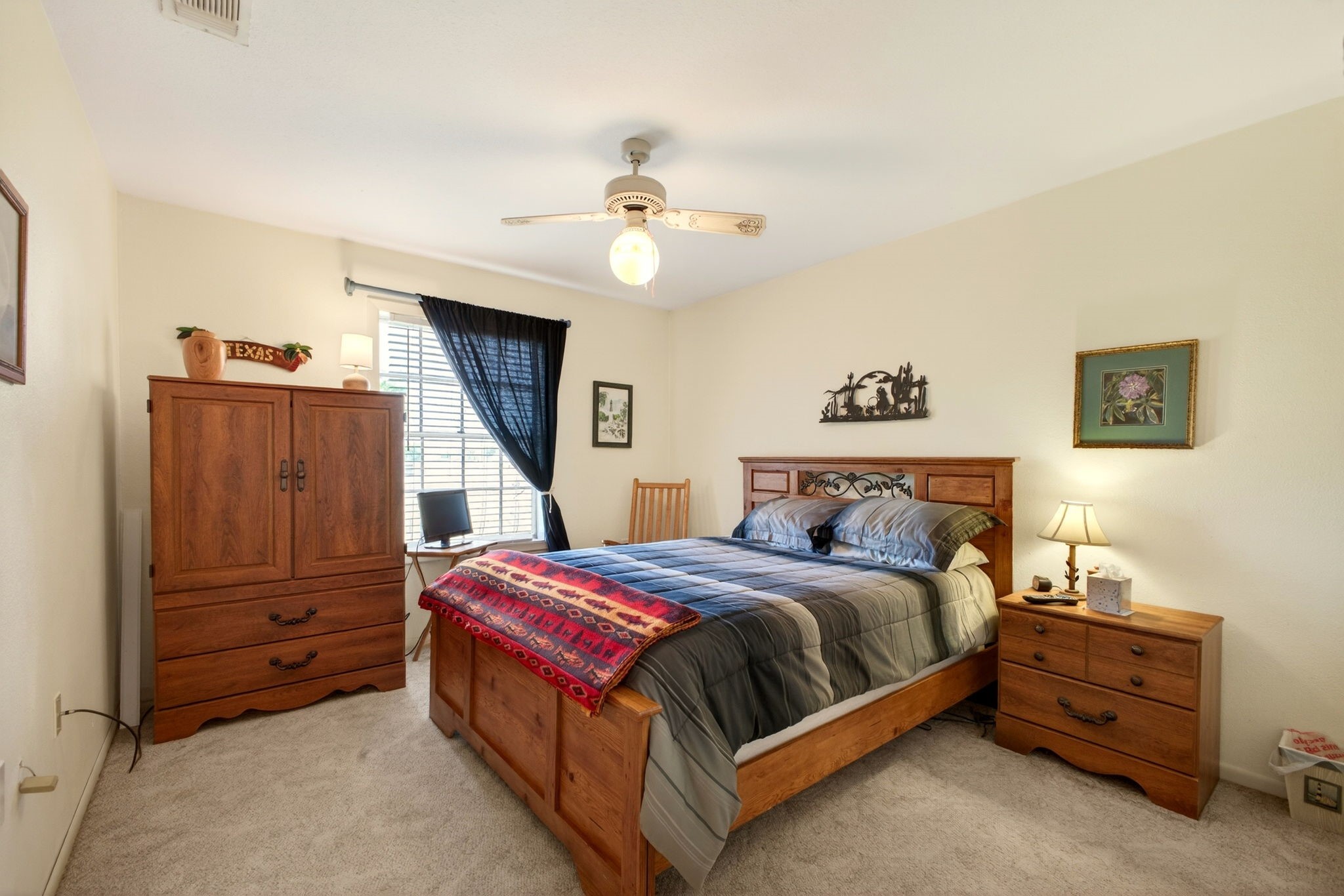 212 Halstedt Road La Grange, TX 78945 - Photo 16 of 40 a bedroom with a bed dresser and a flat tv screen