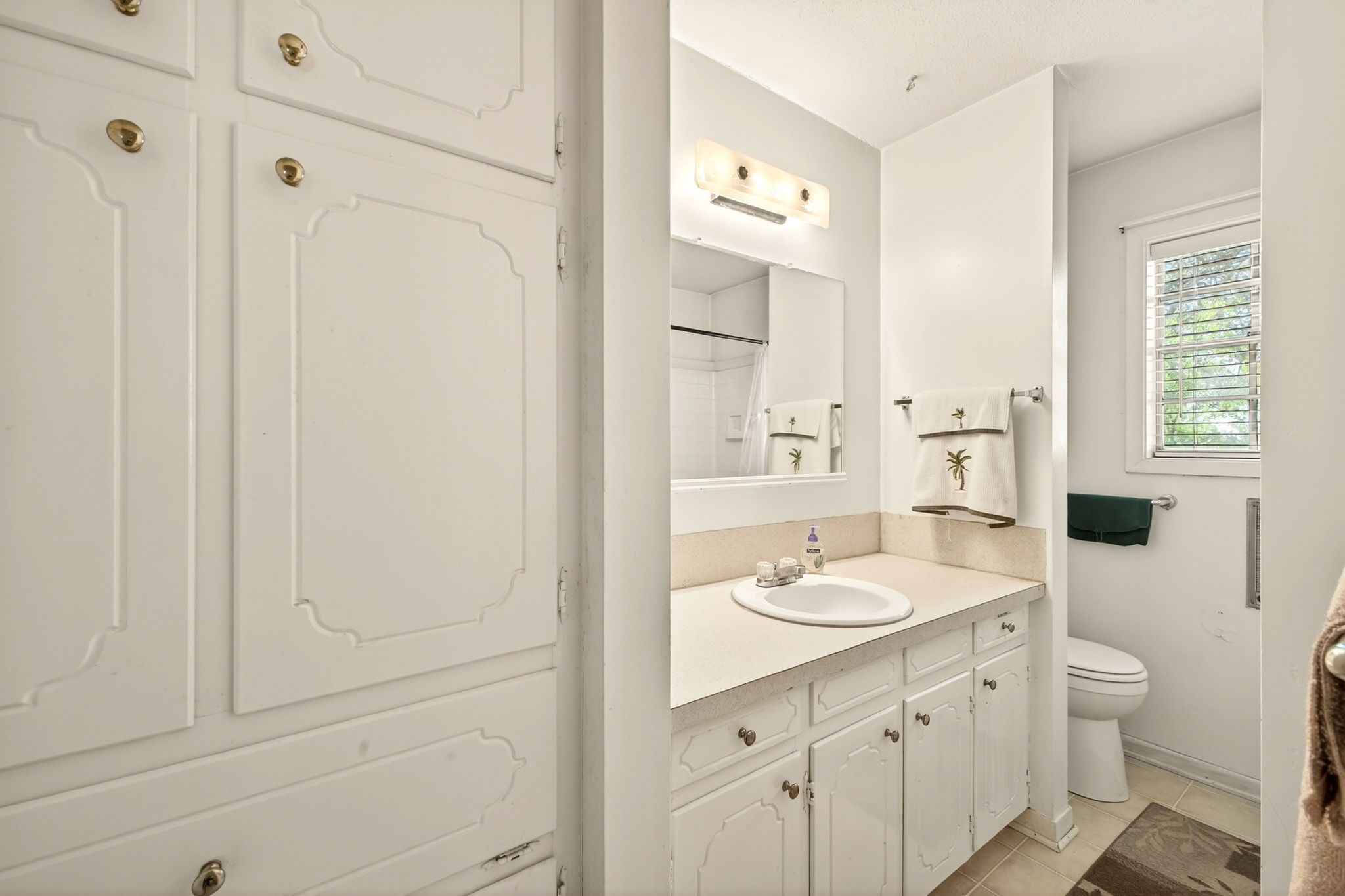 212 Halstedt Road La Grange, TX 78945 - Photo 17 of 40 a bathroom with a granite countertop sink and a mirror