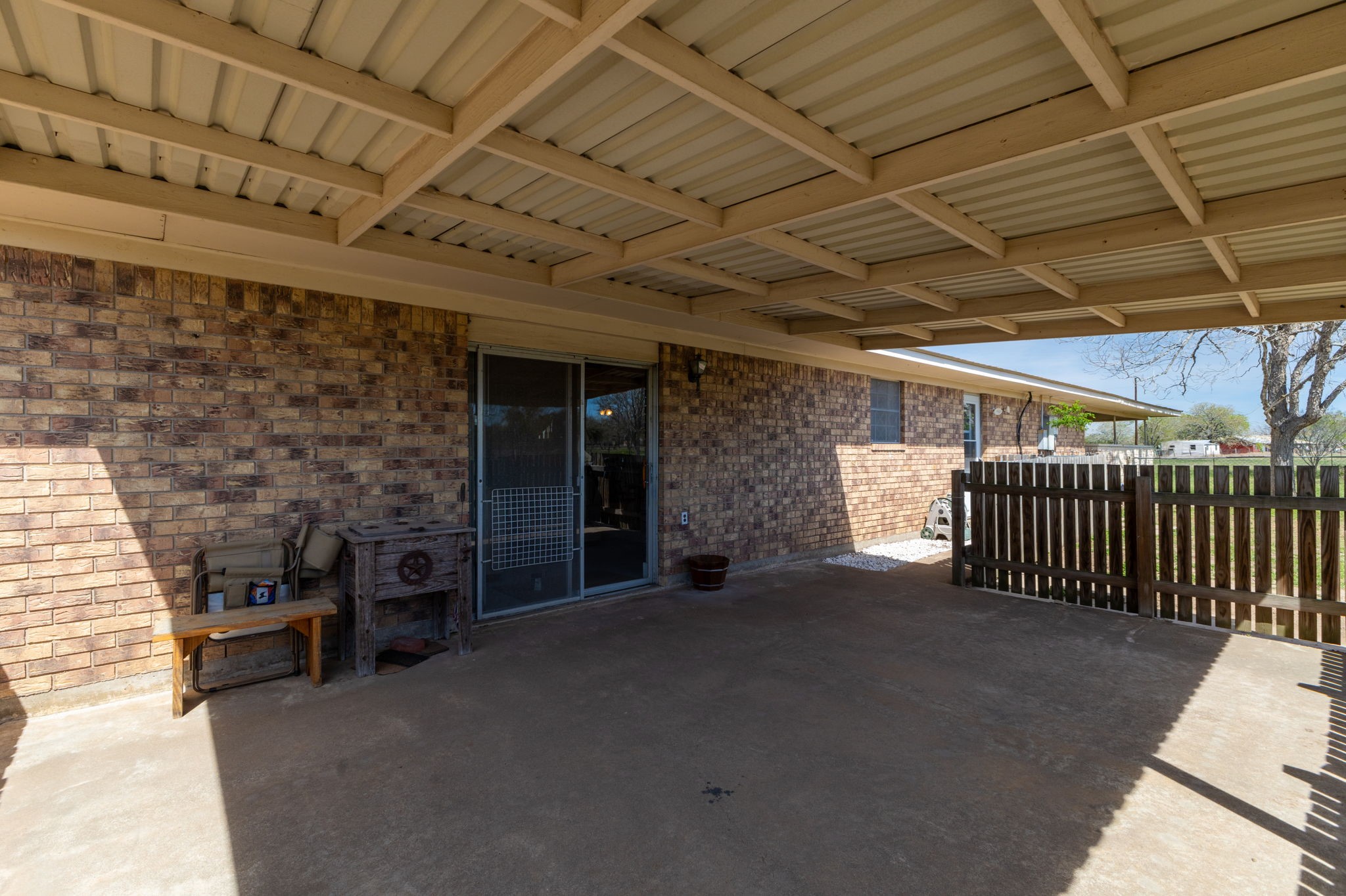 212 Halstedt Road La Grange, TX 78945 - Photo 24 of 40 a view of a porch with a table and chairs