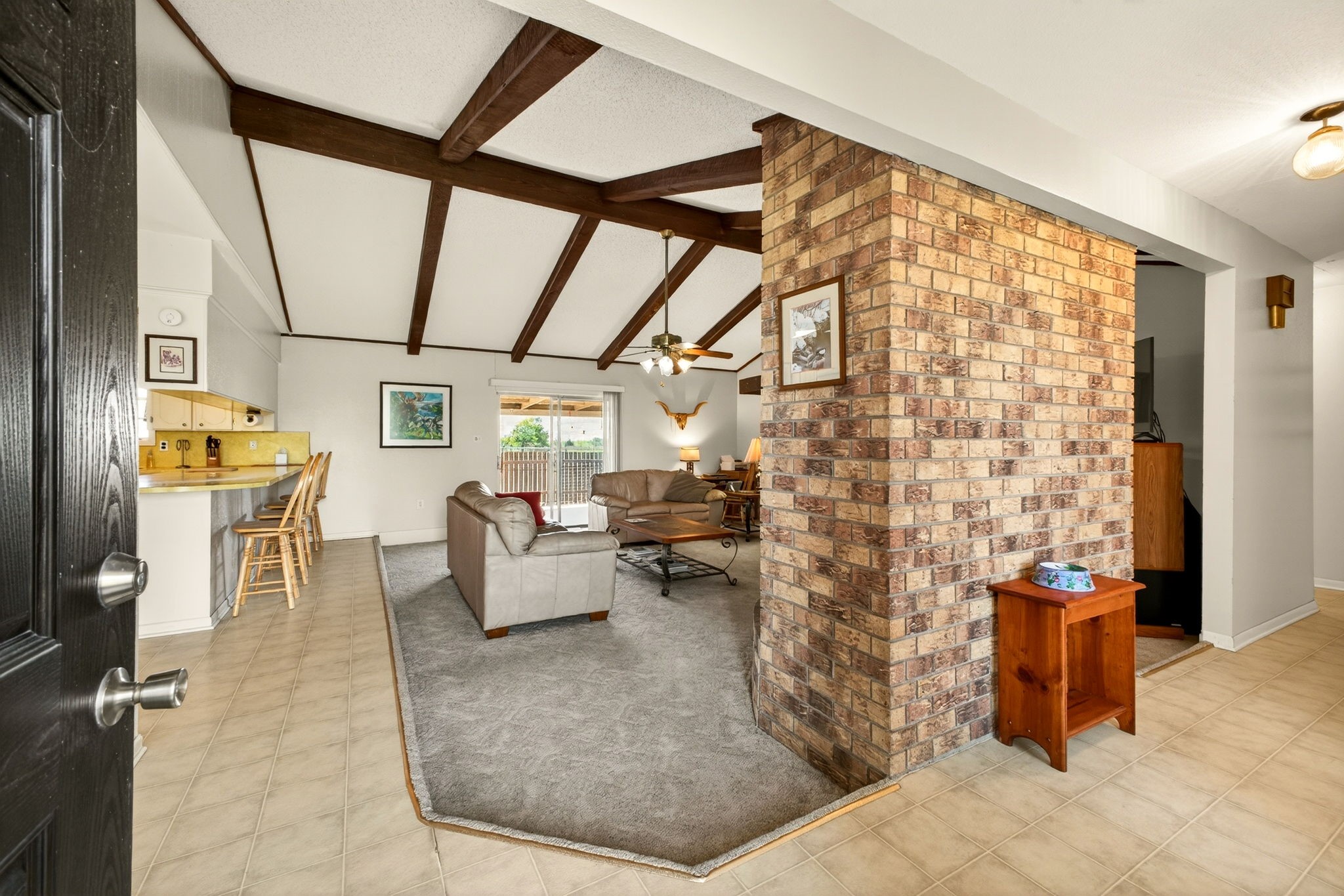 212 Halstedt Road La Grange, TX 78945 - Photo 3 of 40 a living room with patio furniture and a fireplace