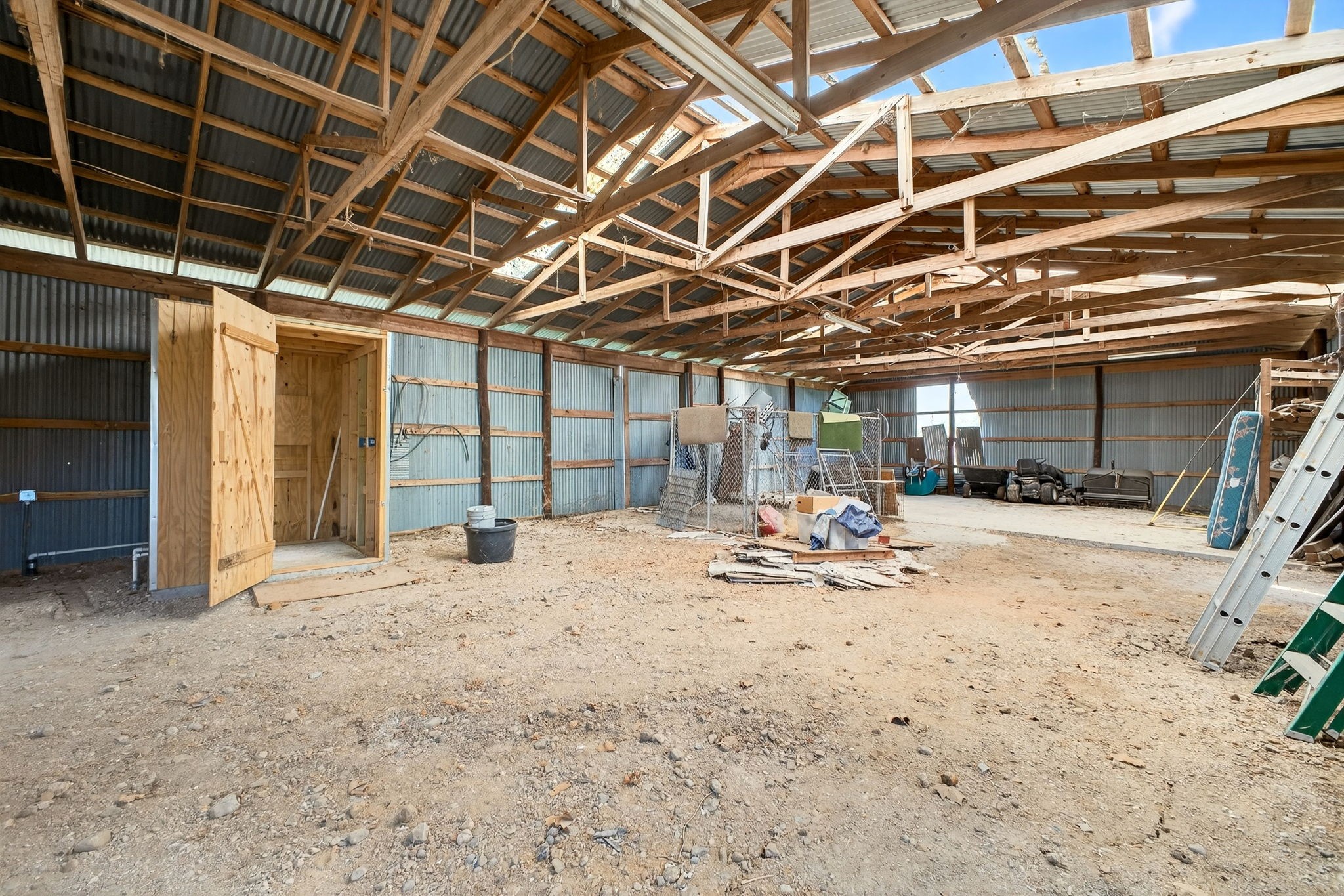 212 Halstedt Road La Grange, TX 78945 - Photo 39 of 40 a view of a garage with wooden floors