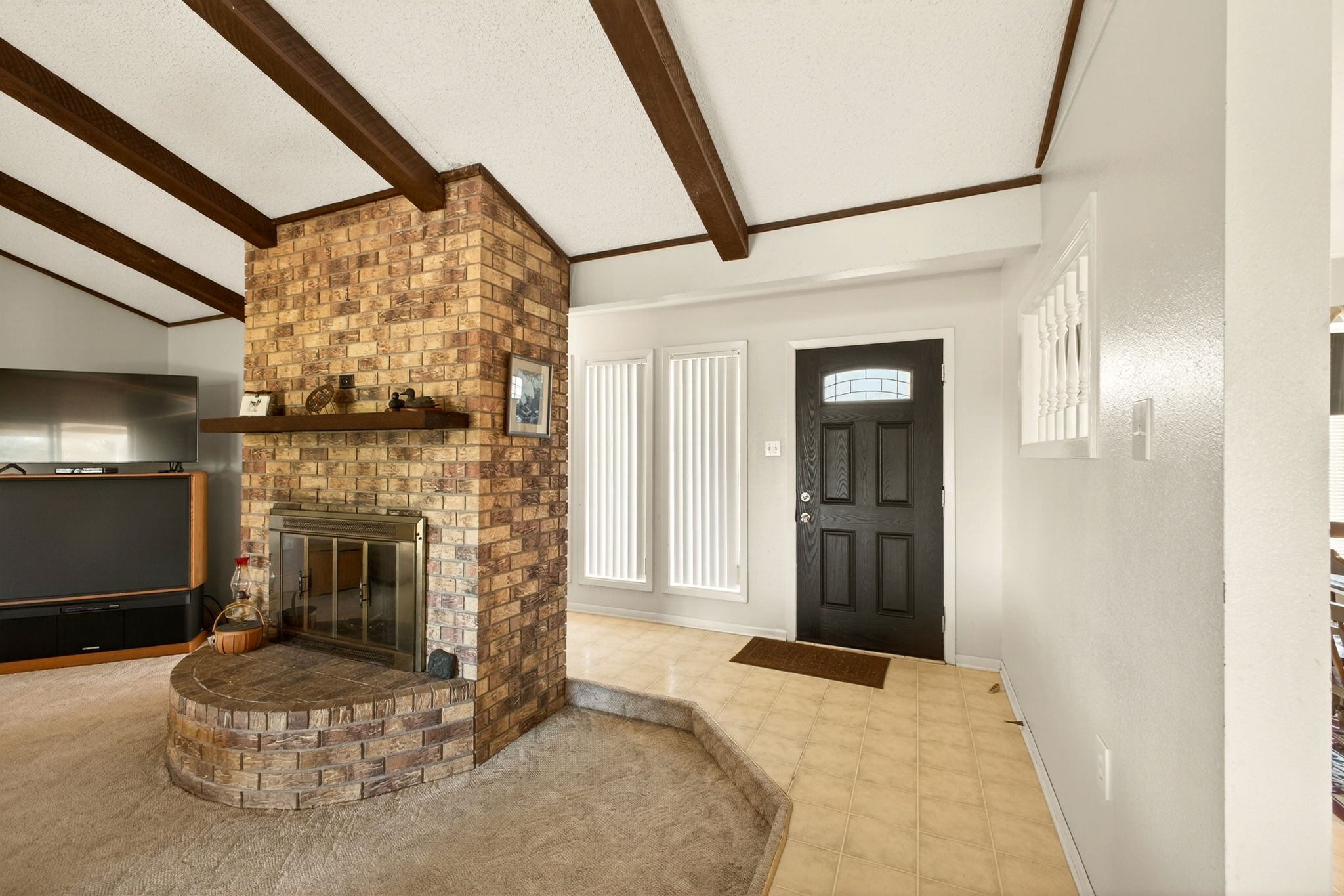 212 Halstedt Road La Grange, TX 78945 - Photo 5 of 40 a bedroom with a bed and a fireplace