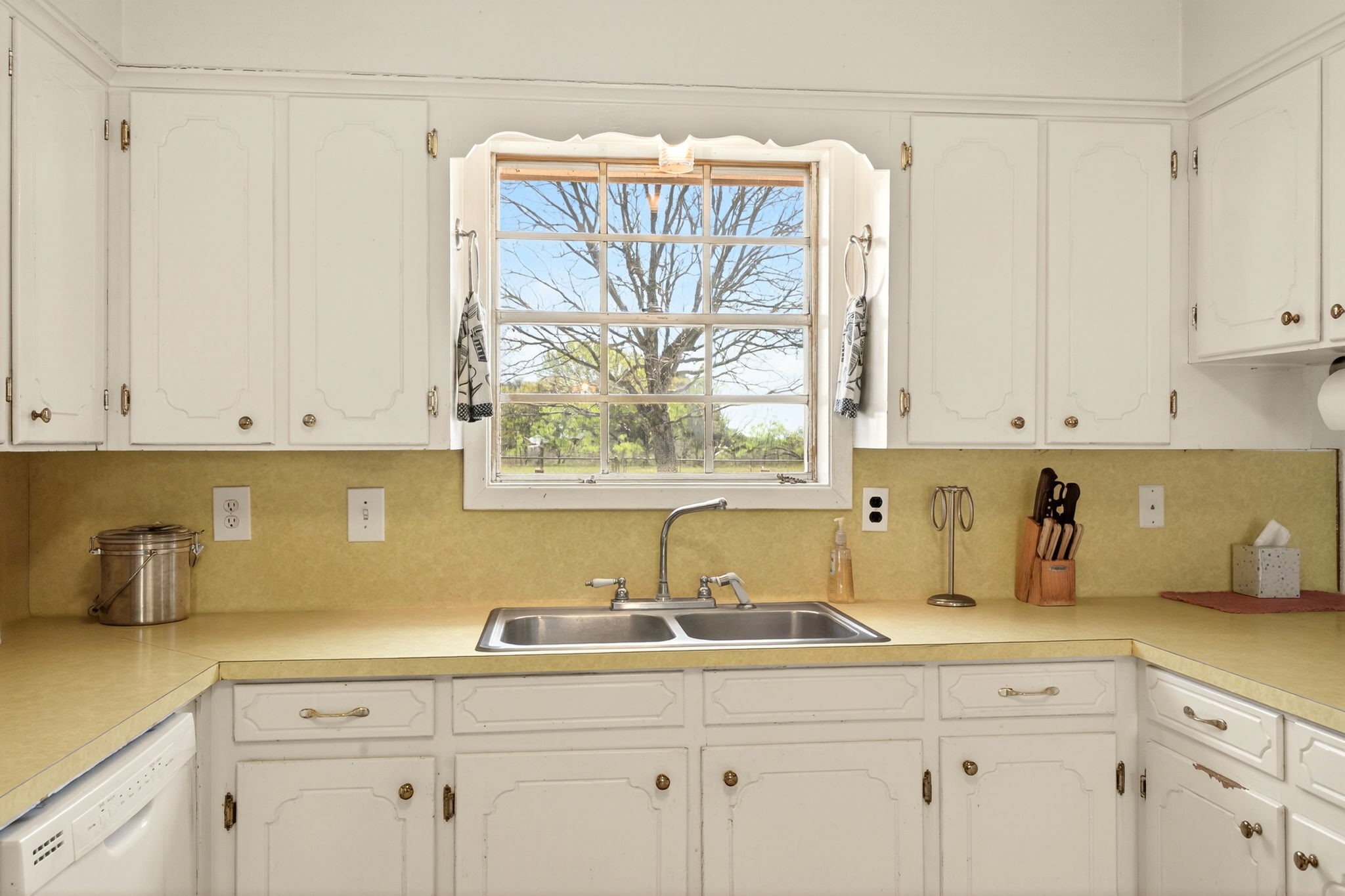 212 Halstedt Road La Grange, TX 78945 - Photo 9 of 40 a kitchen with a sink and cabinets