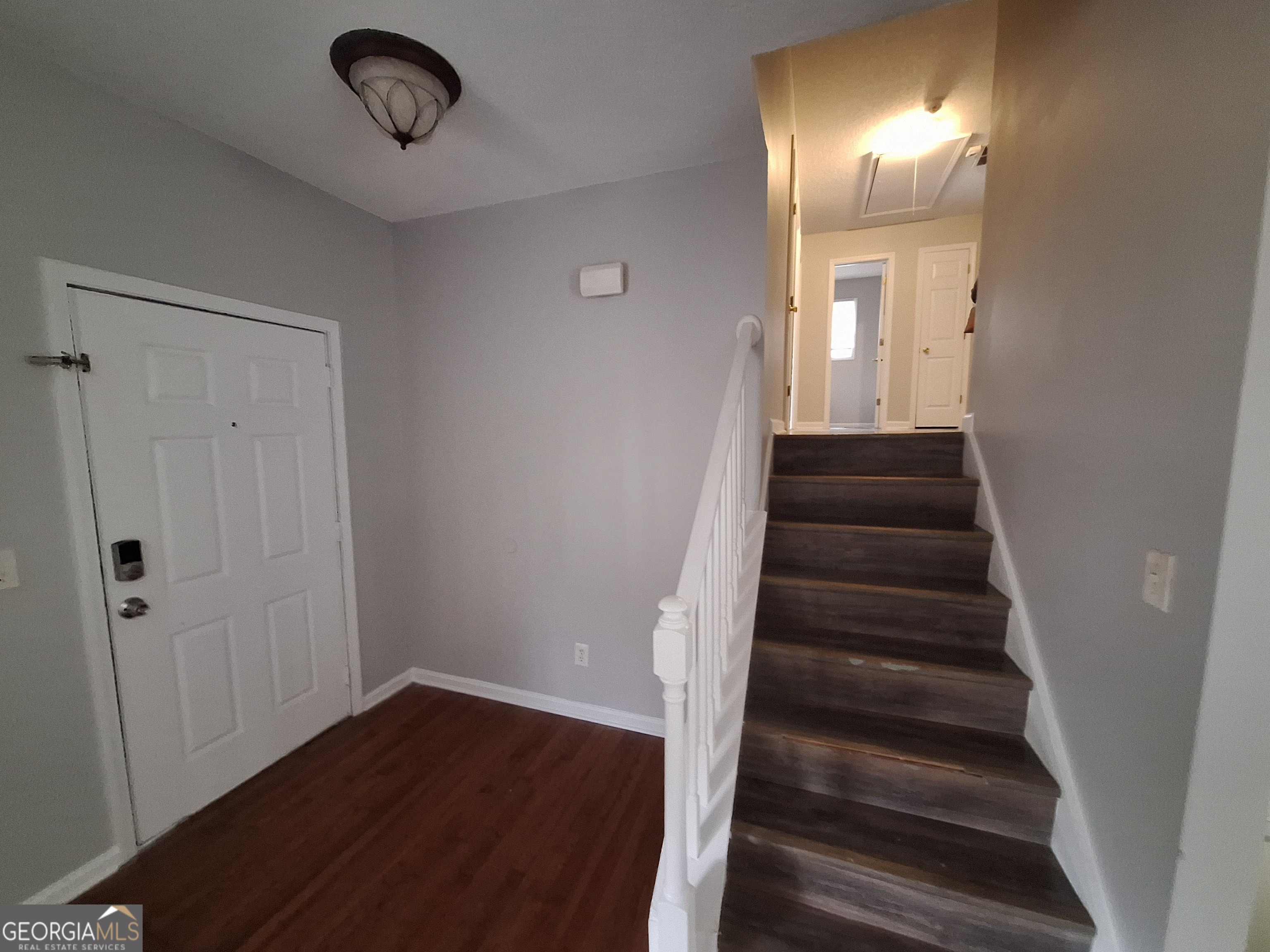 5633 Rutland Drive Southwest Powder Springs, GA 30127 - Photo 8 of 11 a view of a hallway with wooden floor and entryway
