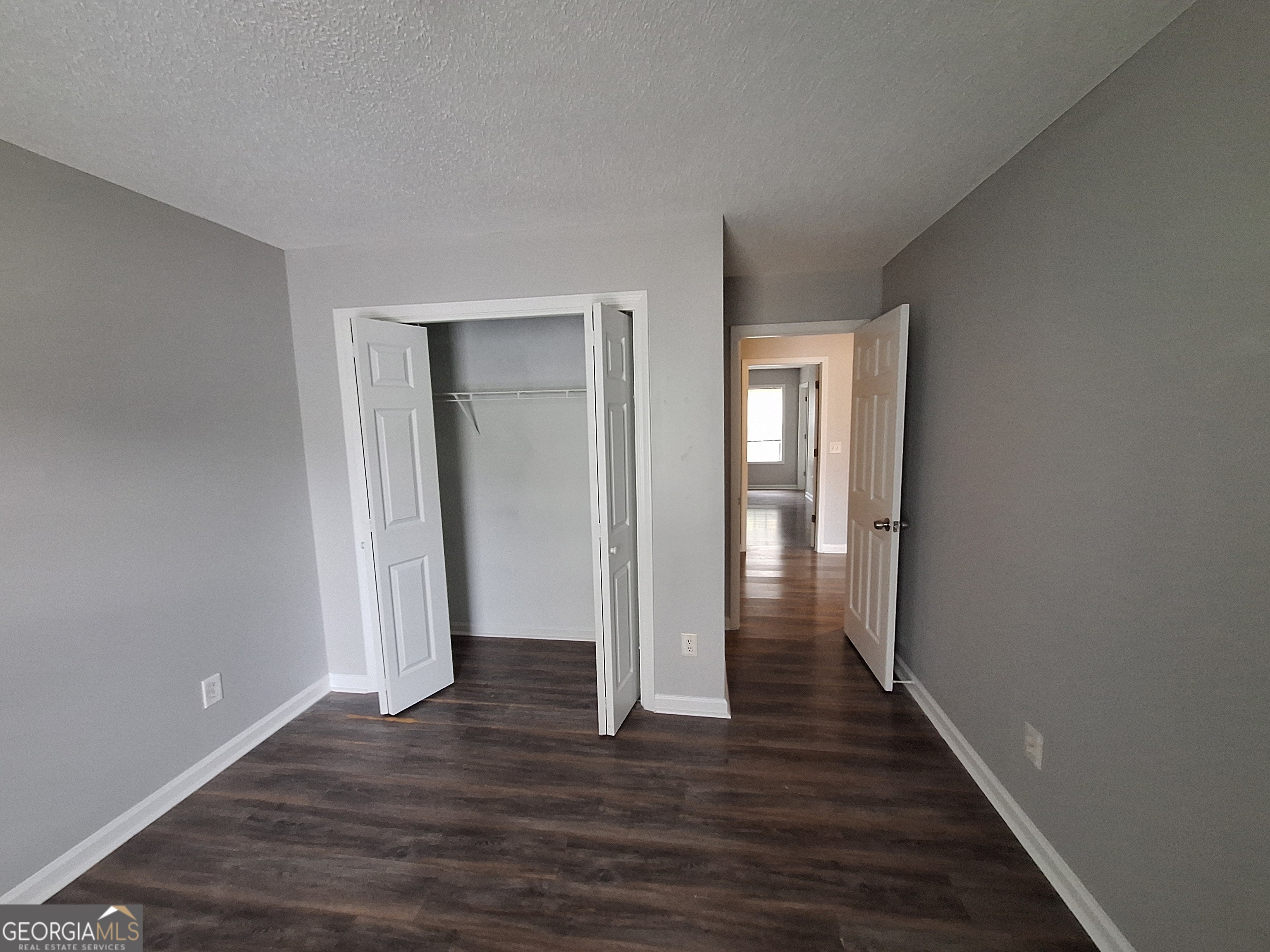5633 Rutland Drive Southwest Powder Springs, GA 30127 - Photo 10 of 11 a view of hallway with wooden floor