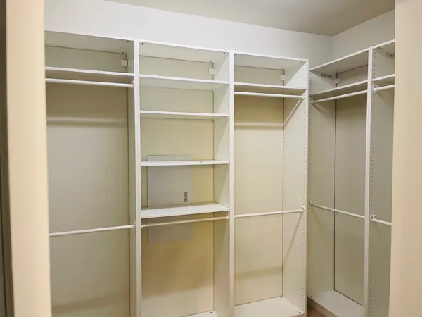 a view of an empty walk in closet