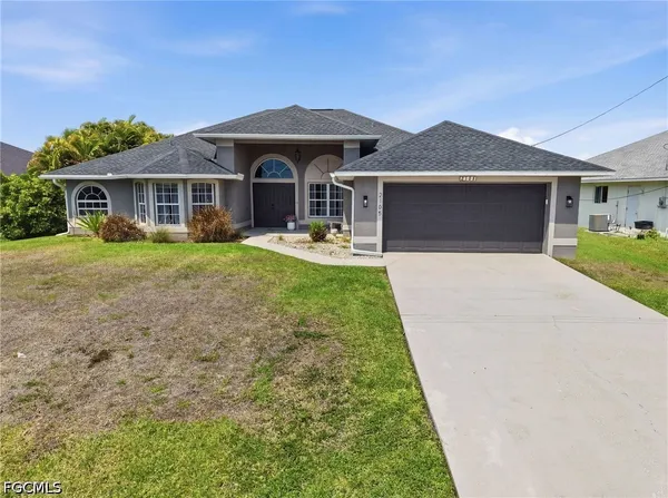 a front view of a house with yard