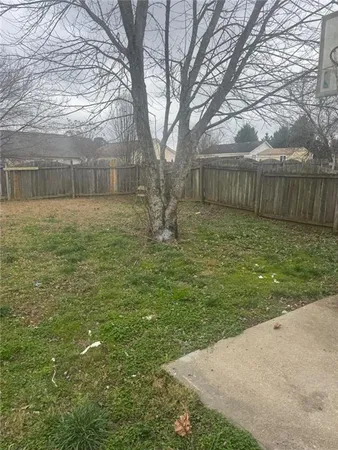 a backyard of a house with lots of green space
