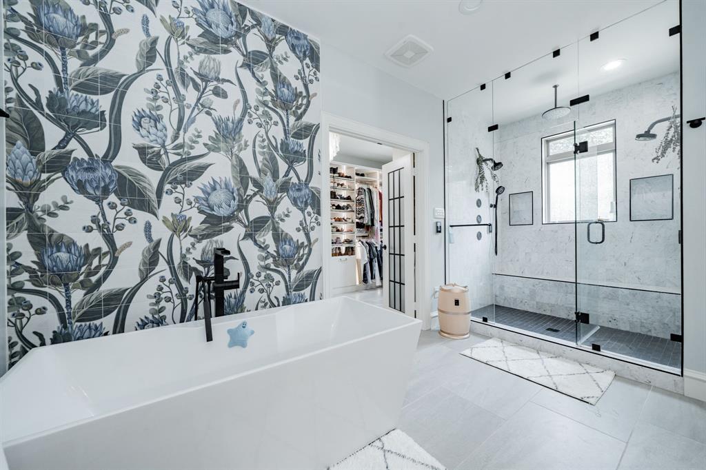 5517 Longview Street Dallas, TX 75206 - Photo 27 of 33 a bathroom with a bathtub and a shower