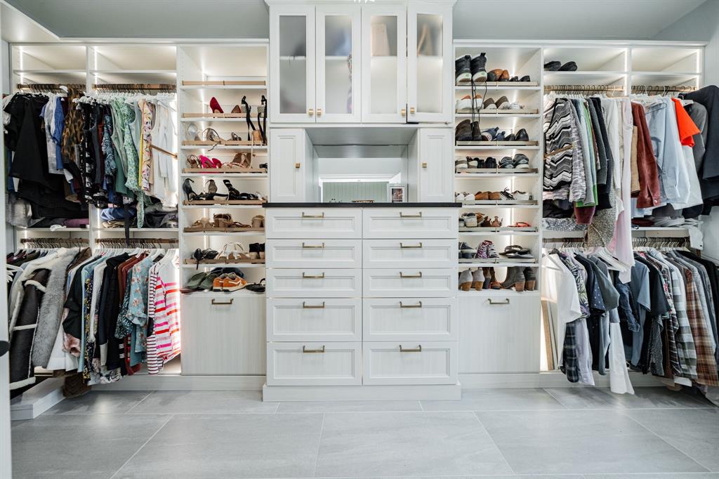5517 Longview Street Dallas, TX 75206 - Photo 28 of 33 a view of walk in closet with clothes and shoes