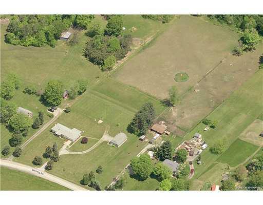 1636 Banning Road Dawson, PA 15428 - Photo 2 of 2 Aerial View. The property is rectangular and runs all the way to the wood line in the rear and is impressively table top level. Zoned Agricultural as well which allows you to have horses and other live stock!