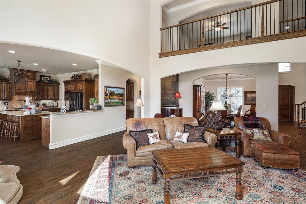 1031 Fox Bend Way Prosper, TX 75078 - Photo 12 of 40 a living room with furniture and kitchen view
