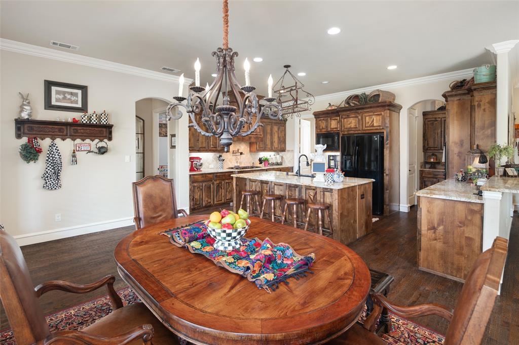 1031 Fox Bend Way Prosper, TX 75078 - Photo 15 of 40 a view of a dining room with furniture
