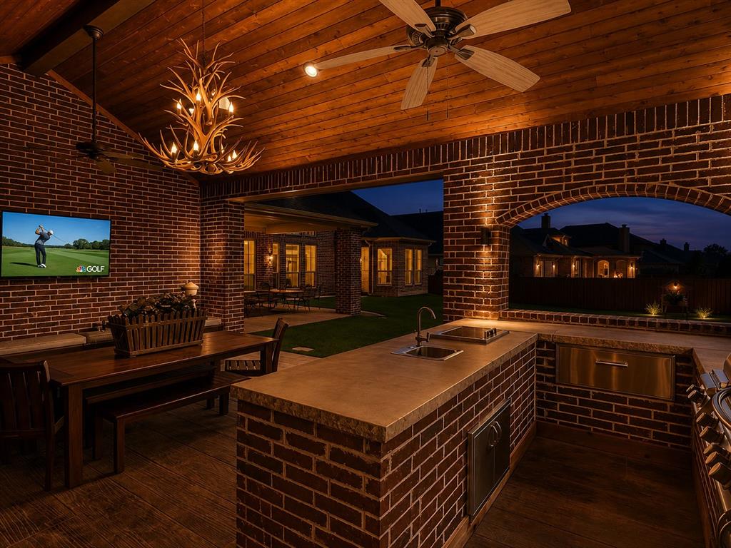 1031 Fox Bend Way Prosper, TX 75078 - Photo 2 of 40 a outdoor space with patio furniture and a fireplace