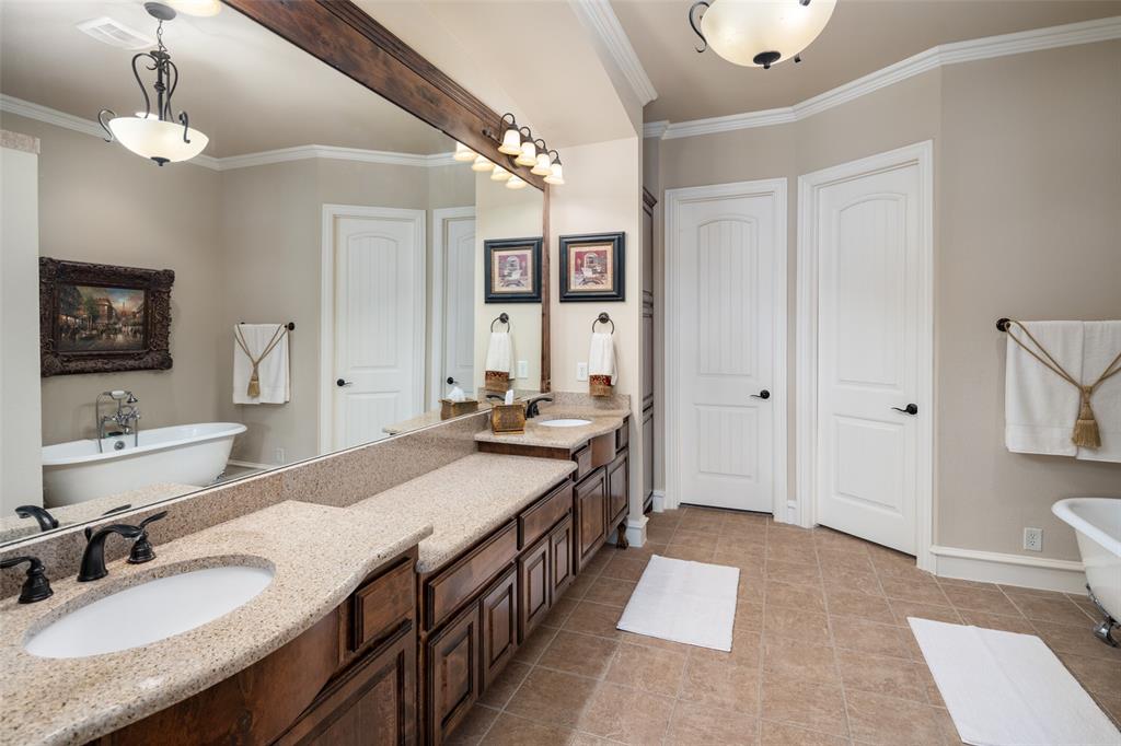 1031 Fox Bend Way Prosper, TX 75078 - Photo 21 of 40 a spacious bathroom with a tub double sink and a mirror