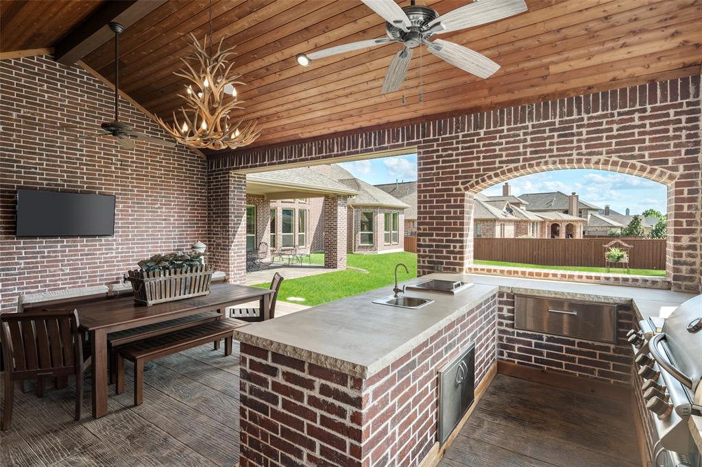 1031 Fox Bend Way Prosper, TX 75078 - Photo 3 of 40 a open kitchen with a table and chairs