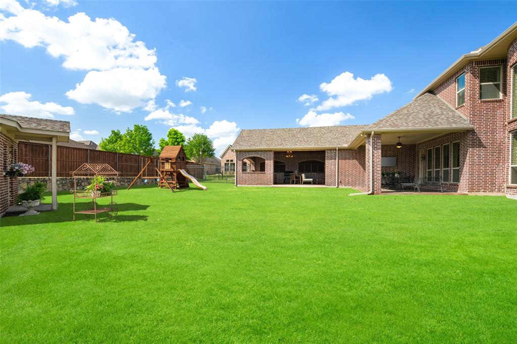 1031 Fox Bend Way Prosper, TX 75078 - Photo 33 of 40 a view of a house with a yard porch and sitting area