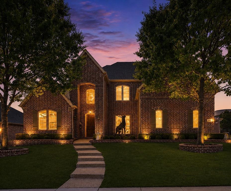 1031 Fox Bend Way Prosper, TX 75078 - Photo 4 of 40 a front view of a house with a yard