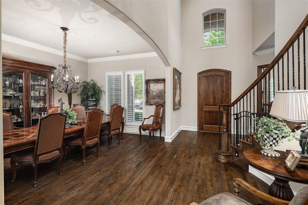 1031 Fox Bend Way Prosper, TX 75078 - Photo 8 of 40 a view of a livingroom with furniture wooden floor windows and a chandelier