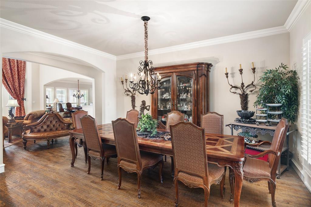 1031 Fox Bend Way Prosper, TX 75078 - Photo 9 of 40 a view of a dining room with furniture window and wooden floor
