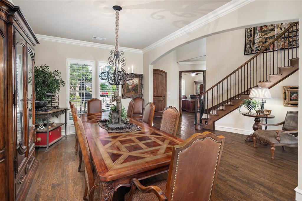 1031 Fox Bend Way Prosper, TX 75078 - Photo 10 of 40 a view of a dining room with furniture window and wooden floor