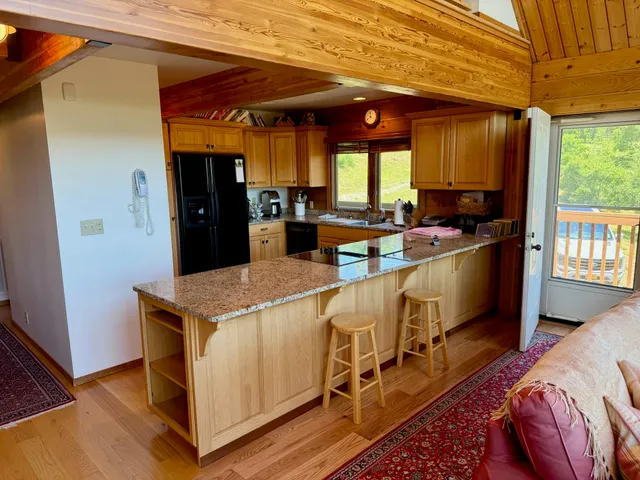 a view of a livingroom with furniture and window