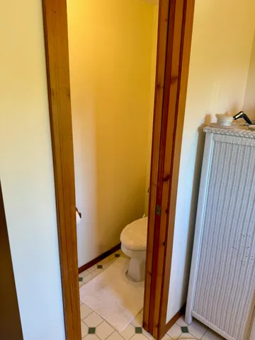 a bedroom with a bed next to a window