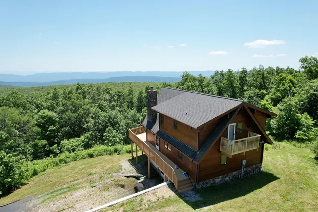 a view of a two chair in the middle of a garden