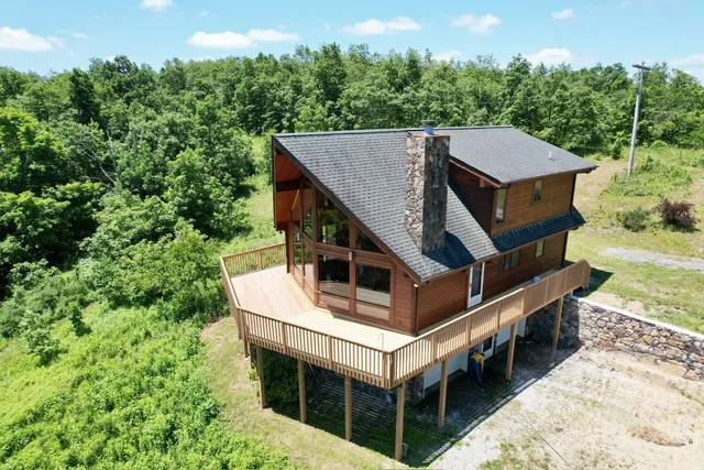 an aerial view of a house with balcony