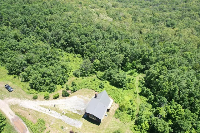 a view of a balcony with chair and wooden floor