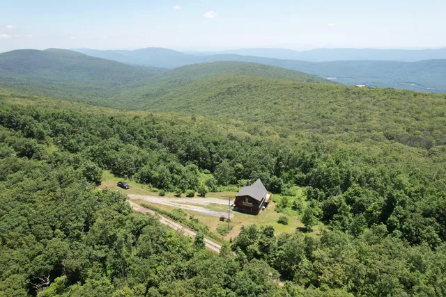 a aerial view of a house with a yard