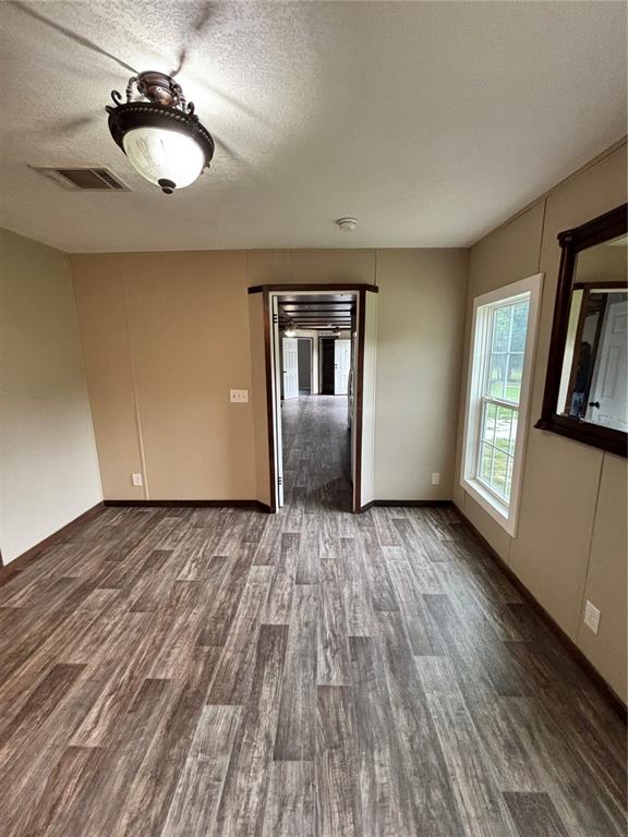 11511 Northeast 110th Road Oxford, FL 34484 - Photo 24 of 43 a view of empty room with wooden floor and fan