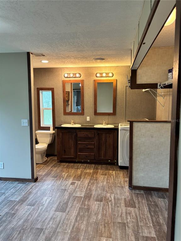11511 Northeast 110th Road Oxford, FL 34484 - Photo 25 of 43 a bathroom with a double vanity sink and a mirror